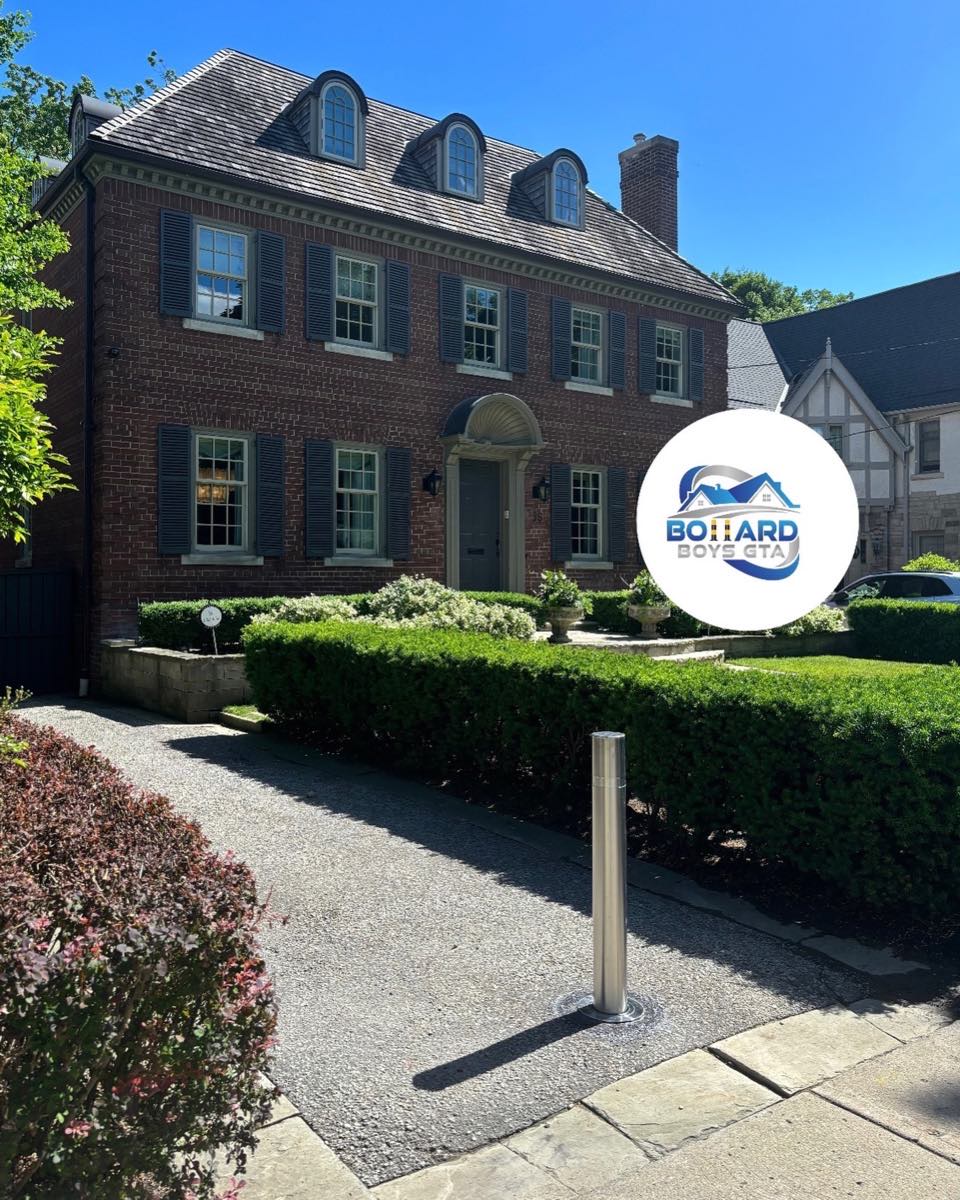 Single stainless bollard on a heritage home driveway