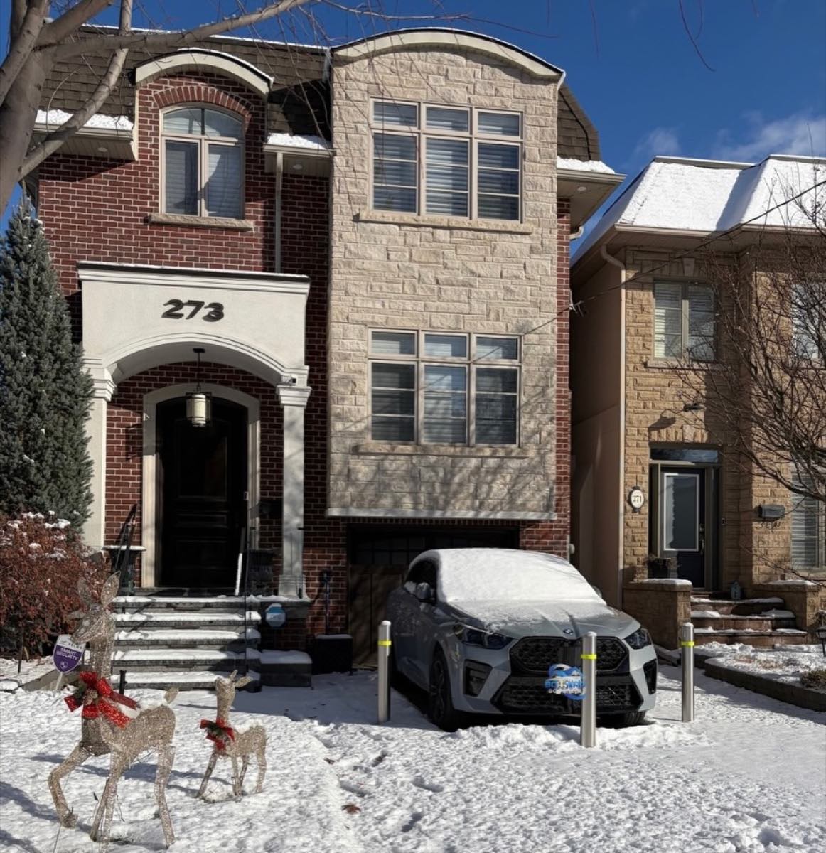 Stainless removable bollards on a winter driveway